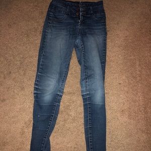 Stretchy three button high wasted jeans